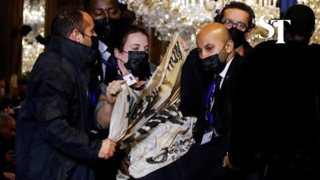 'Climate protestor storms Louis Vuitton catwalk'