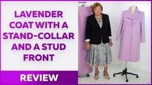 'Lavender coat with a stand-collar and a stud front.  Review of the finished garment.'